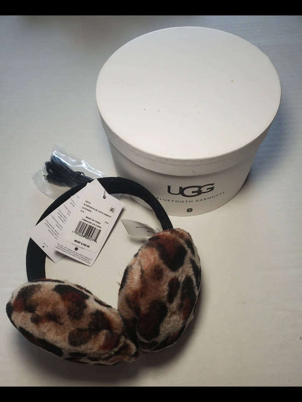 UGG Sheepskin Leopard Print Adjustable Wireless Bluetooth Earmuffs. NIB $75.00
